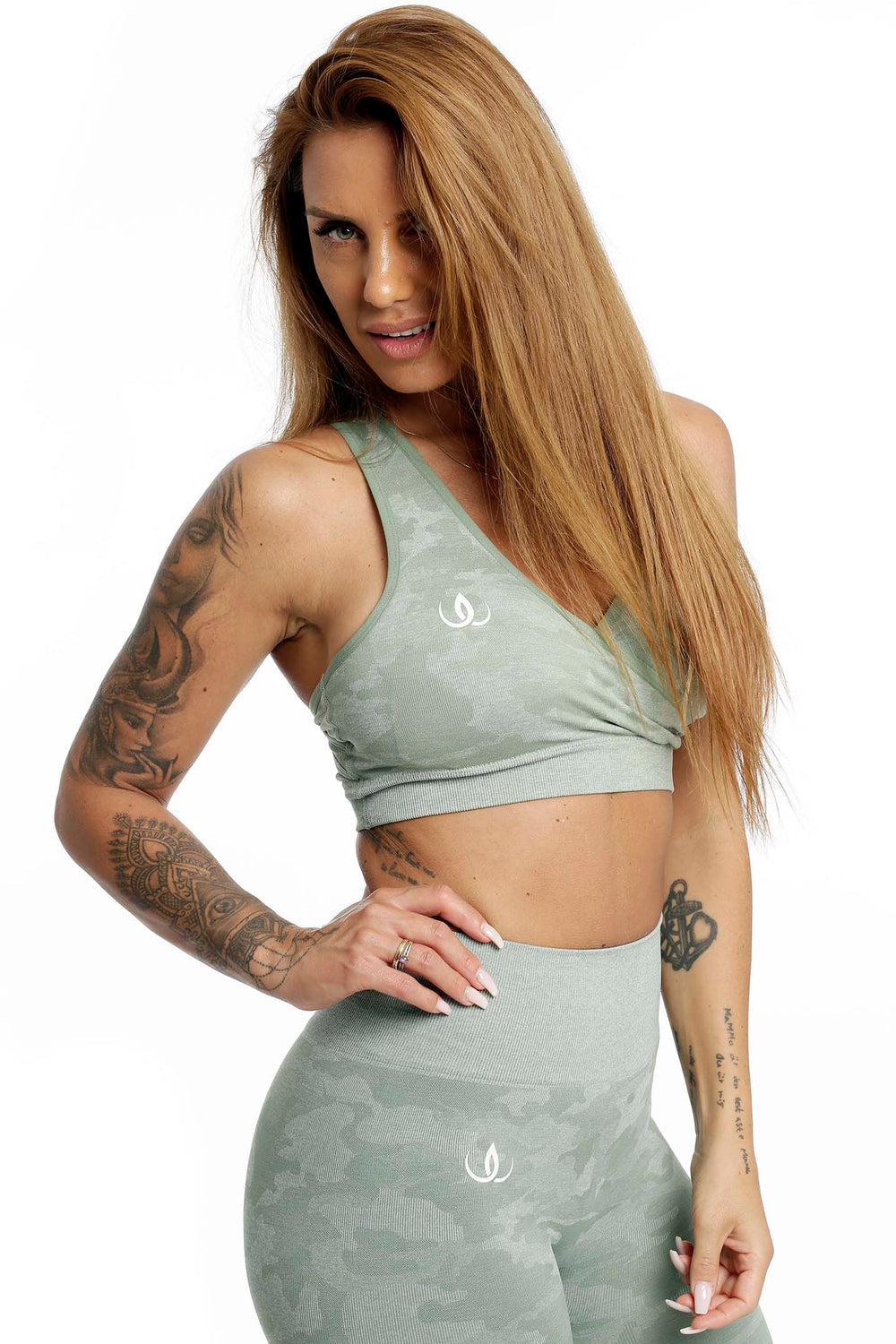 White logo on the mint green top that fits close over the waist, leggings in the same pattern.
