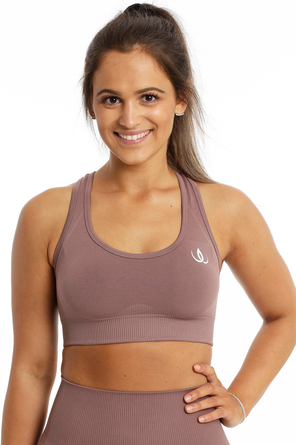 White logo on the chest and a wide ribbed hem on the rose brown top.