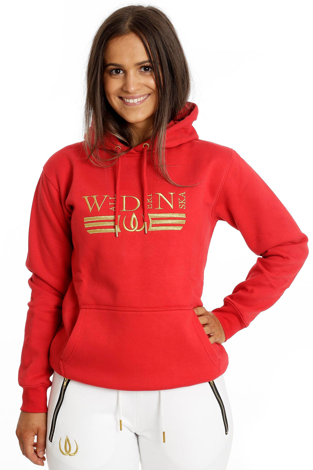 The model wears the red hoodie with gold embroidery and kangaroo pocket with Deluxe Joggers White.
