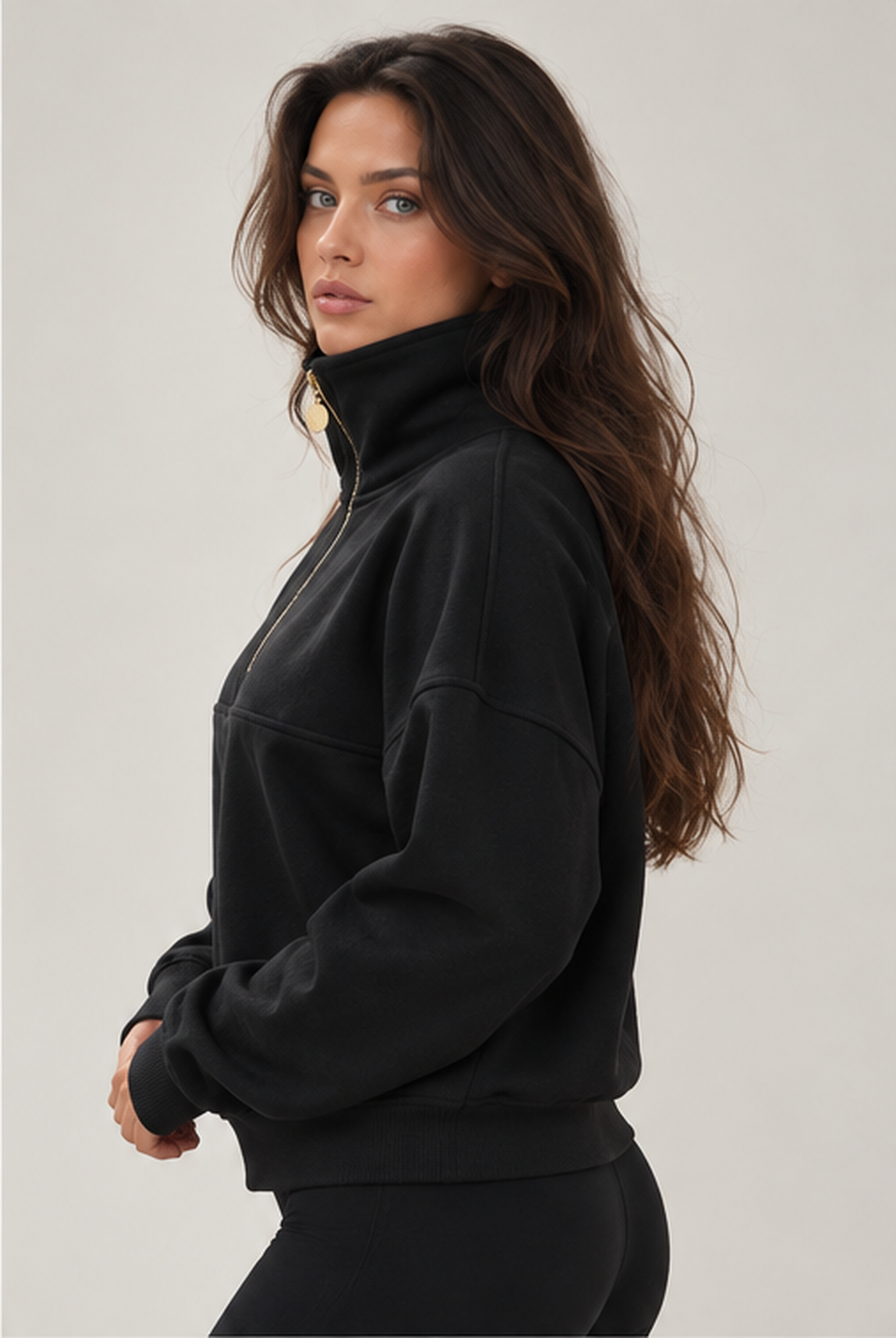 The sweater in profile, with dropped shoulder seams and a wide ribbed hem.
