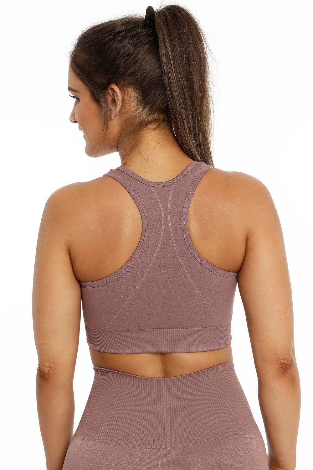 Racerback and ribbed hem on the rose brown top, with matching leggings below.