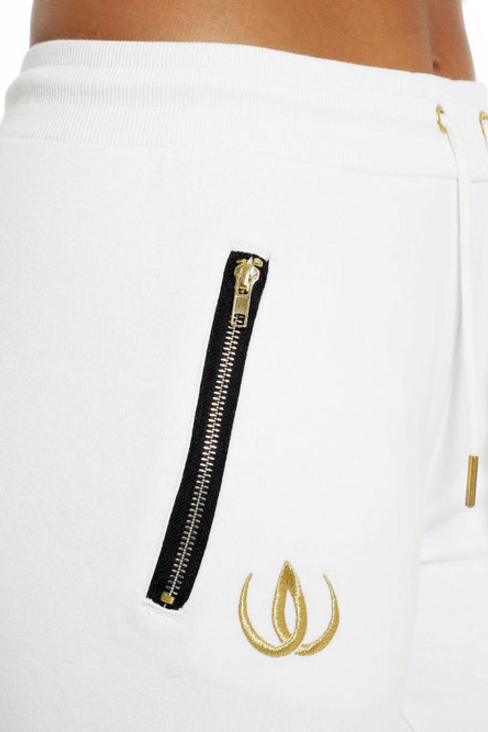 Gold-toned zip on the side pocket and gold logo beneath, with a gold drawstring on the white trousers.