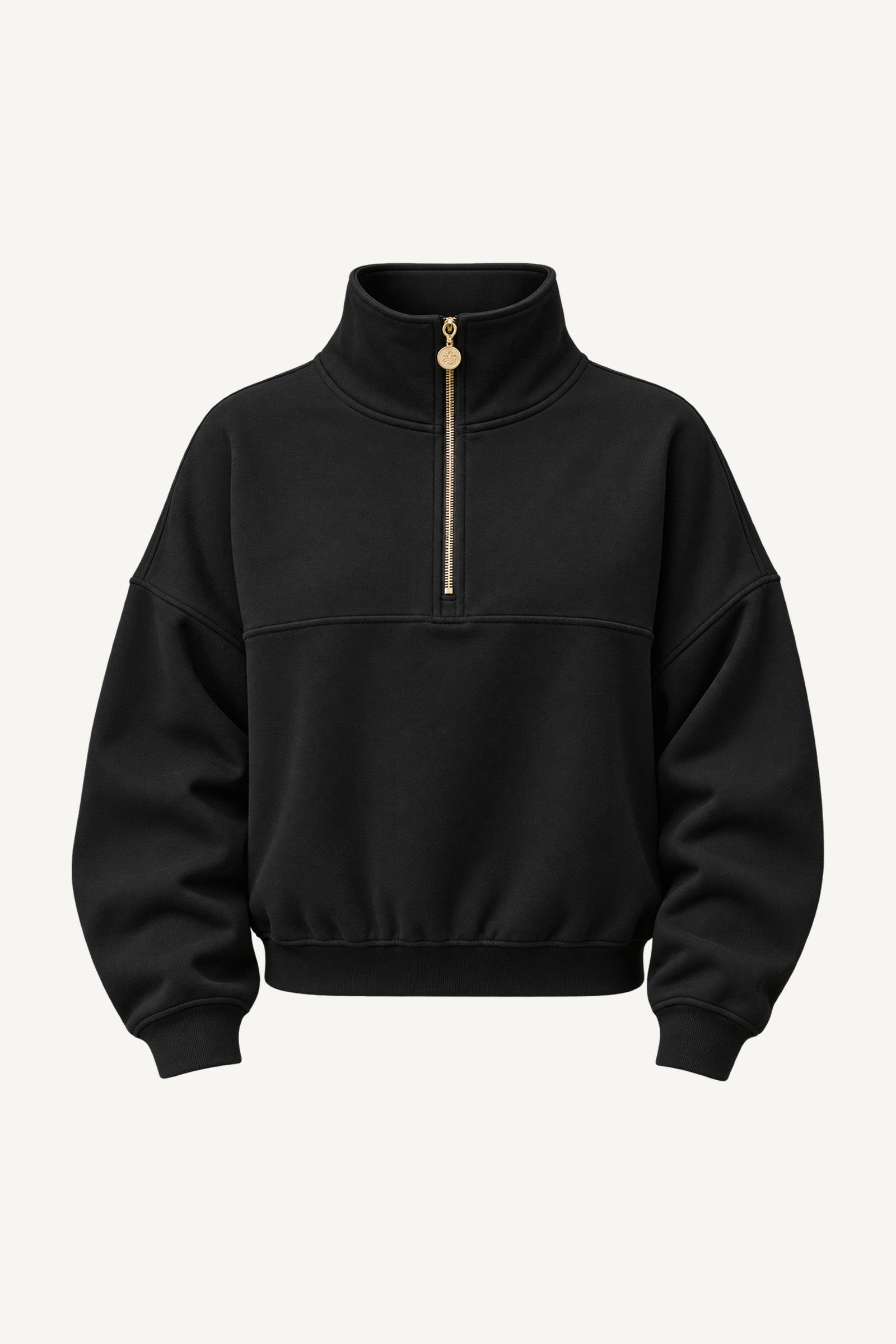 Edge Cozy Half Zip Sweater cut out. Black sweater with a high collar, a gold-coloured zip down to the chest and a wide ribbed hem.