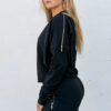 Black exclusive sweater with gold zippers on shoulders